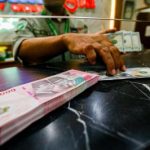 Rupiah Terancam Tembus Rp18000 per Dolar AS